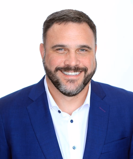 Hadshot of Jason Noble wearing Blue Jacket