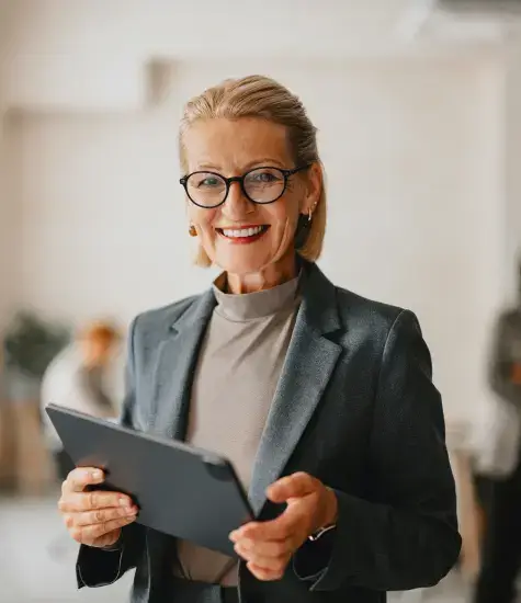 older woman holding what AI considers an iPad I guess